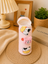 THE LITTLE LOOKERS Soft Plush Stretchable Baby Feeding Bottle Cover with Easy to Hold Strap | Cute Animated Overall Print Pack of 2 (Multicolor, Zip Closure 240ml,/8oz)