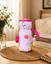 THE LITTLE LOOKERS Soft Plush Stretchable Baby Feeding Bottle Cover with Easy to Hold Strap | Cute Animated Overall Print Pack of 2 (Pink & Blue, Narrow Neck 120ml/4oz)